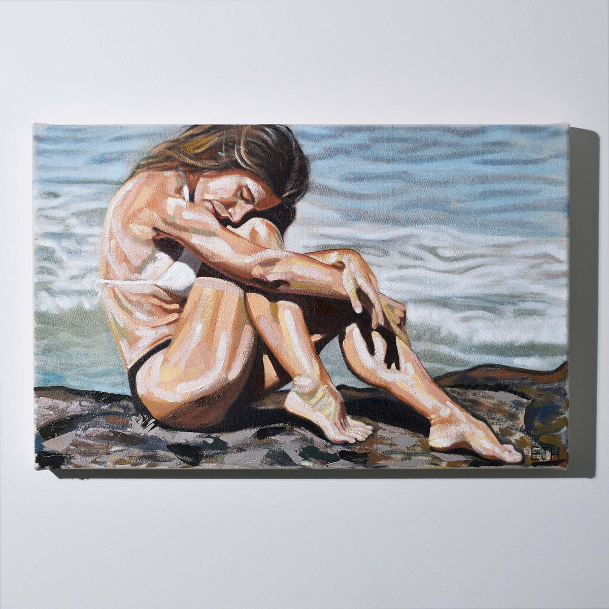 'Celestial Waves' oil painting hanging on a neutral wall in the artist's studio.