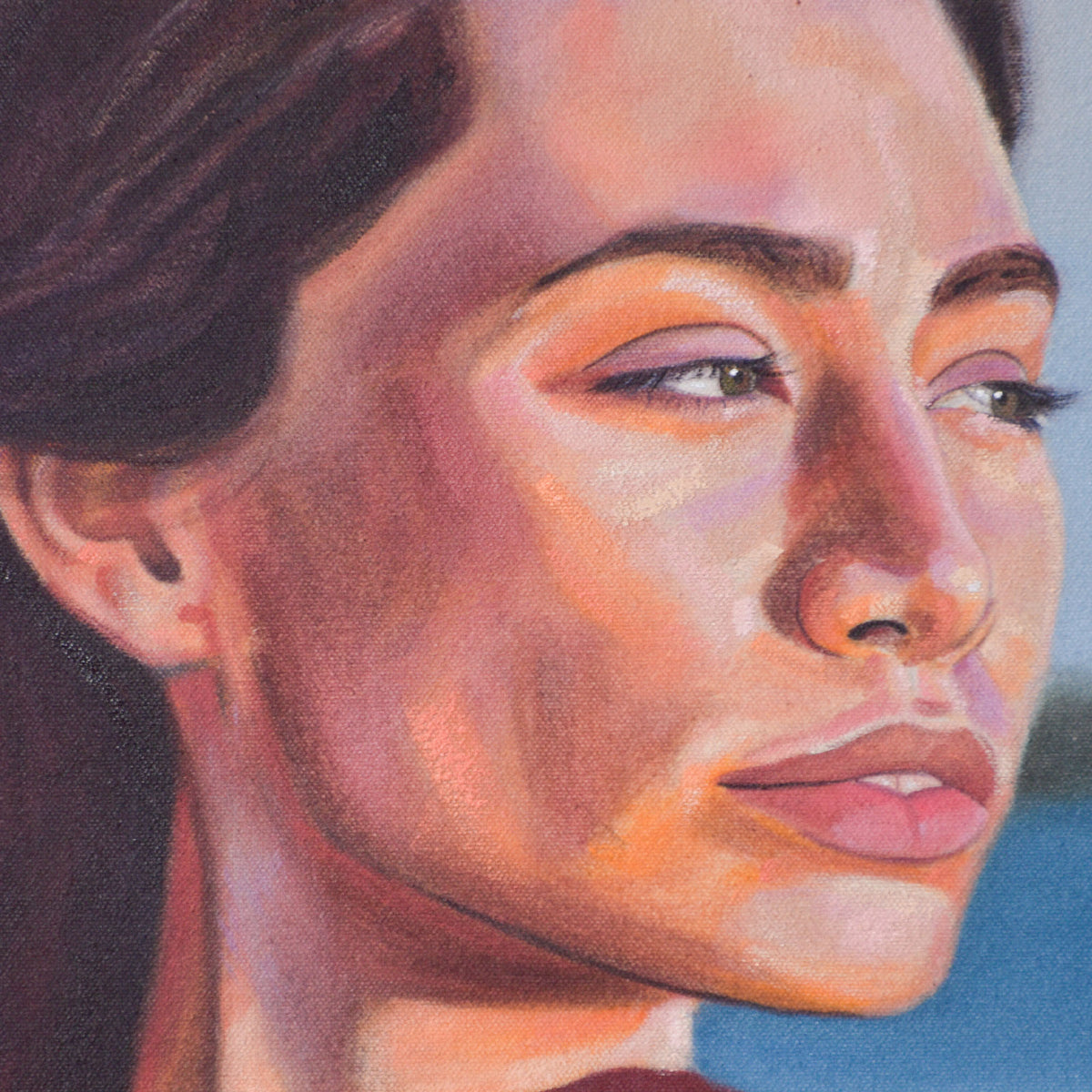 Contemporary portrait painting, close-up of a woman's face with sunset-toned colors on her skin