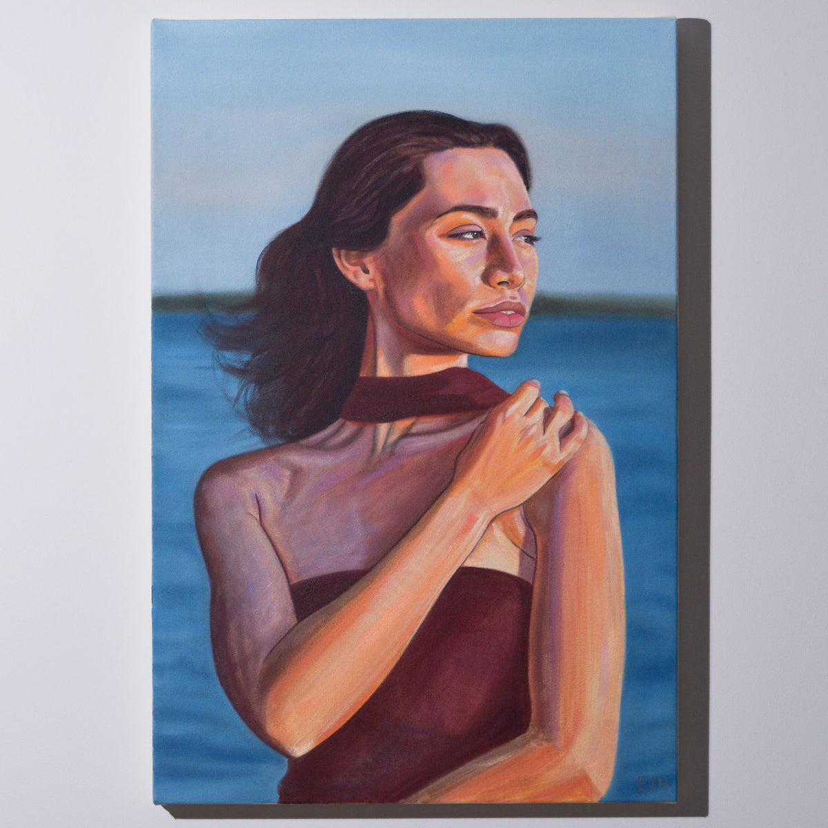 'Golden Hour' oil painting hanging on a neutral wall in the artist's studio.
