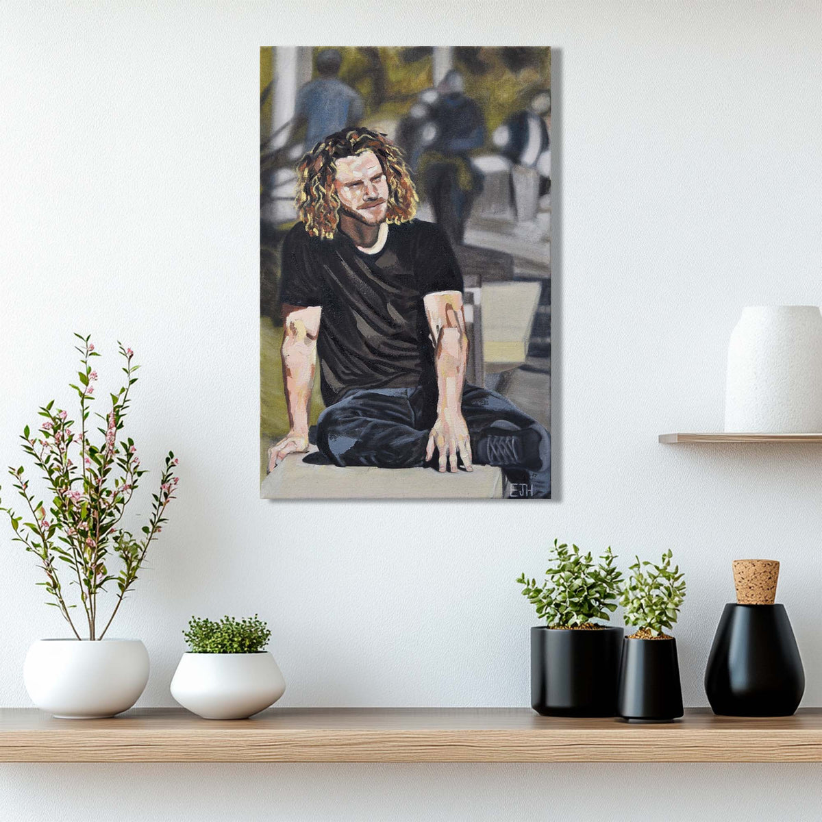 'In A Moment Of Silence' oil painting of a man hanging on a wall above a shelf with decorative plants.