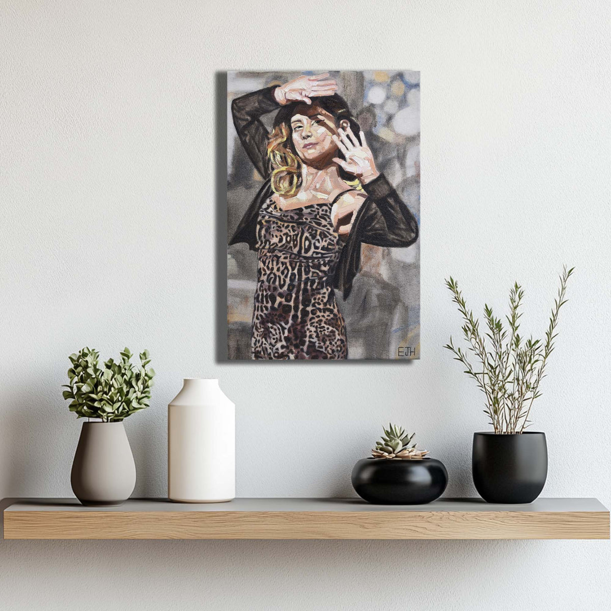 'Sunlit Eyes' oil painting of a woman in a leopard print dress on a wall above a shelf with decorative plants.