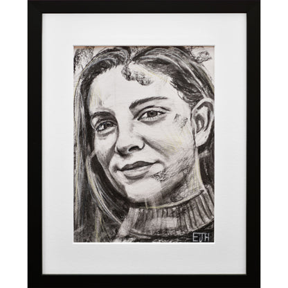 Framed portrait drawing titled 'Believe', 2024 depicting a female subject with a smile.