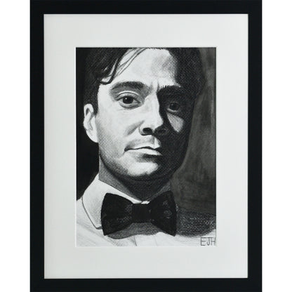 Framed portrait drawing titled 'Beneath The Surface', 2025 depicting portrait of a man with a bow tie.