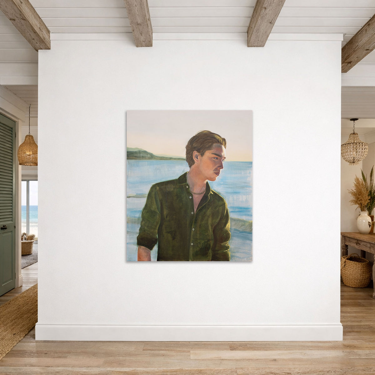 'Clarity' oil painting of a man in a green shirt with a scenic background, hanging on a white wall.