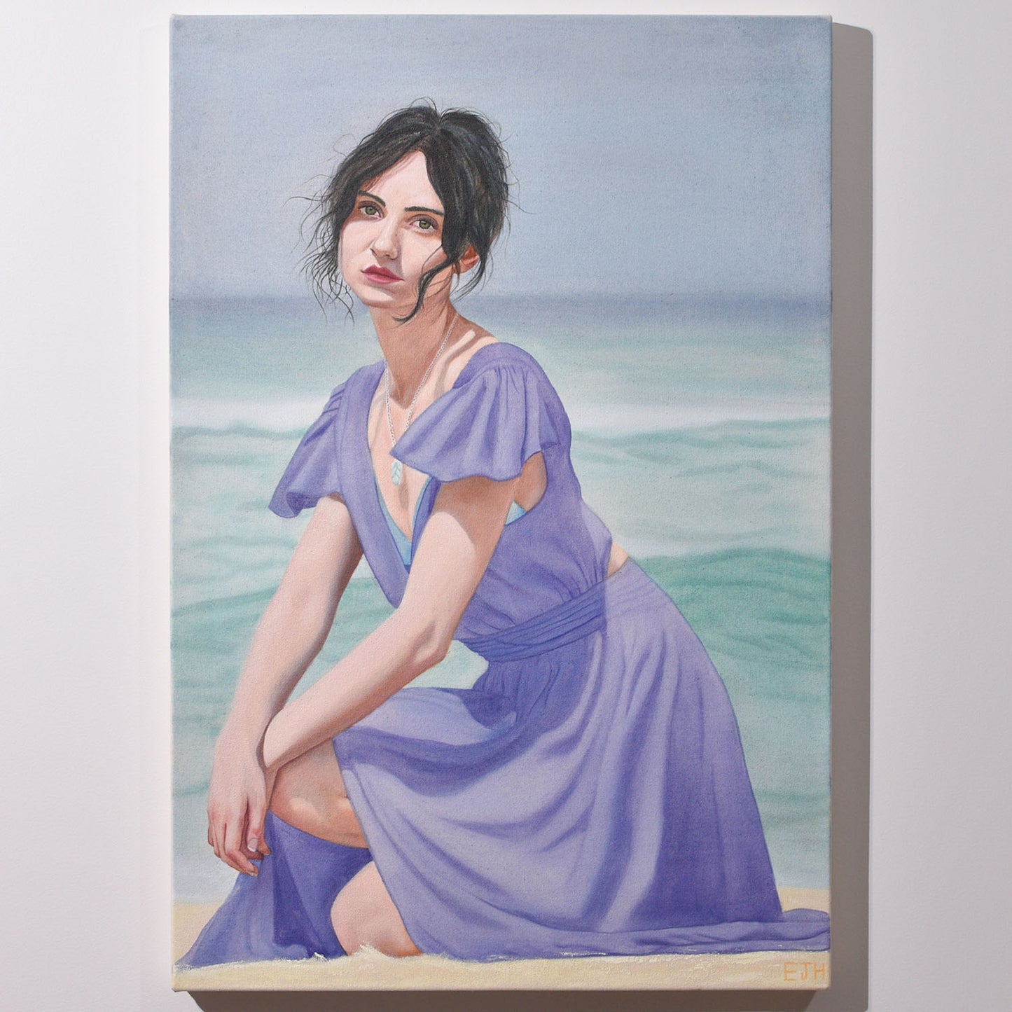 'Delphinium' oil painting hanging on a neutral wall in the artist's studio.