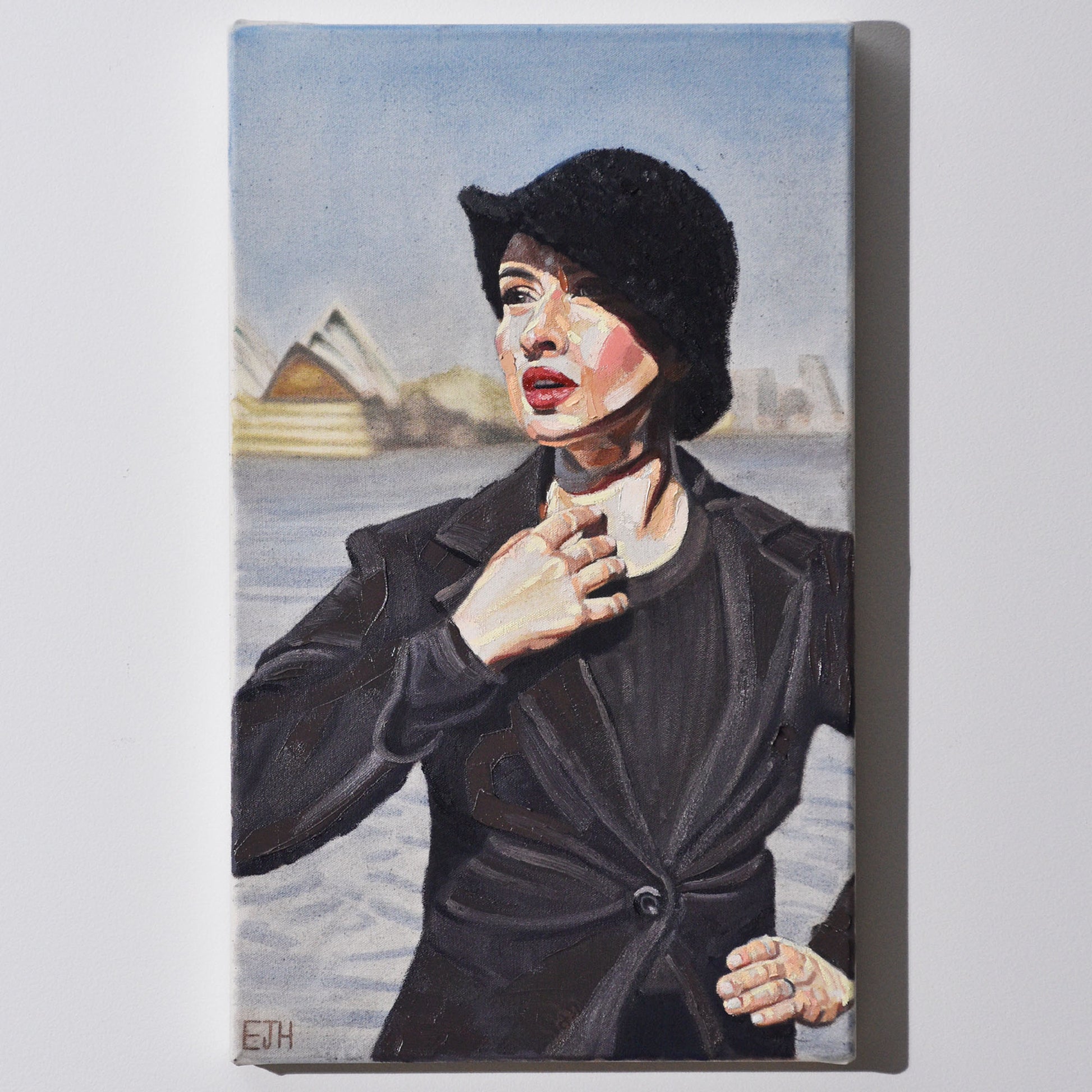 'Harbour View' oil painting hanging on a neutral wall in the artist's studio.