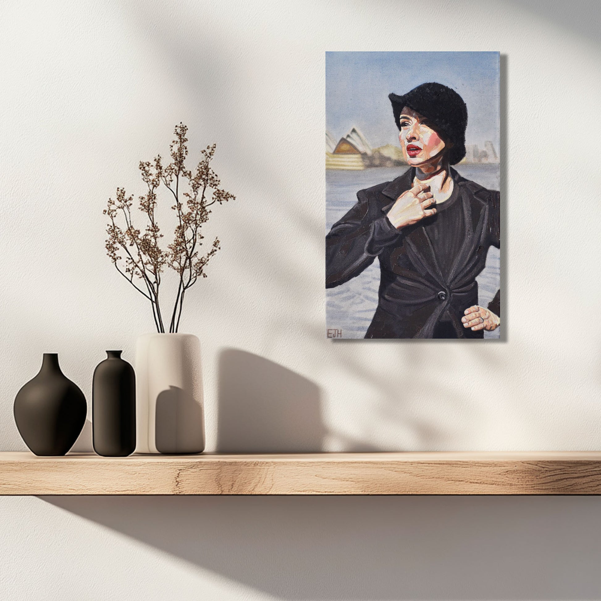 'Harbour View' oil painting of a woman with black jacket hanging above shelf with plants.