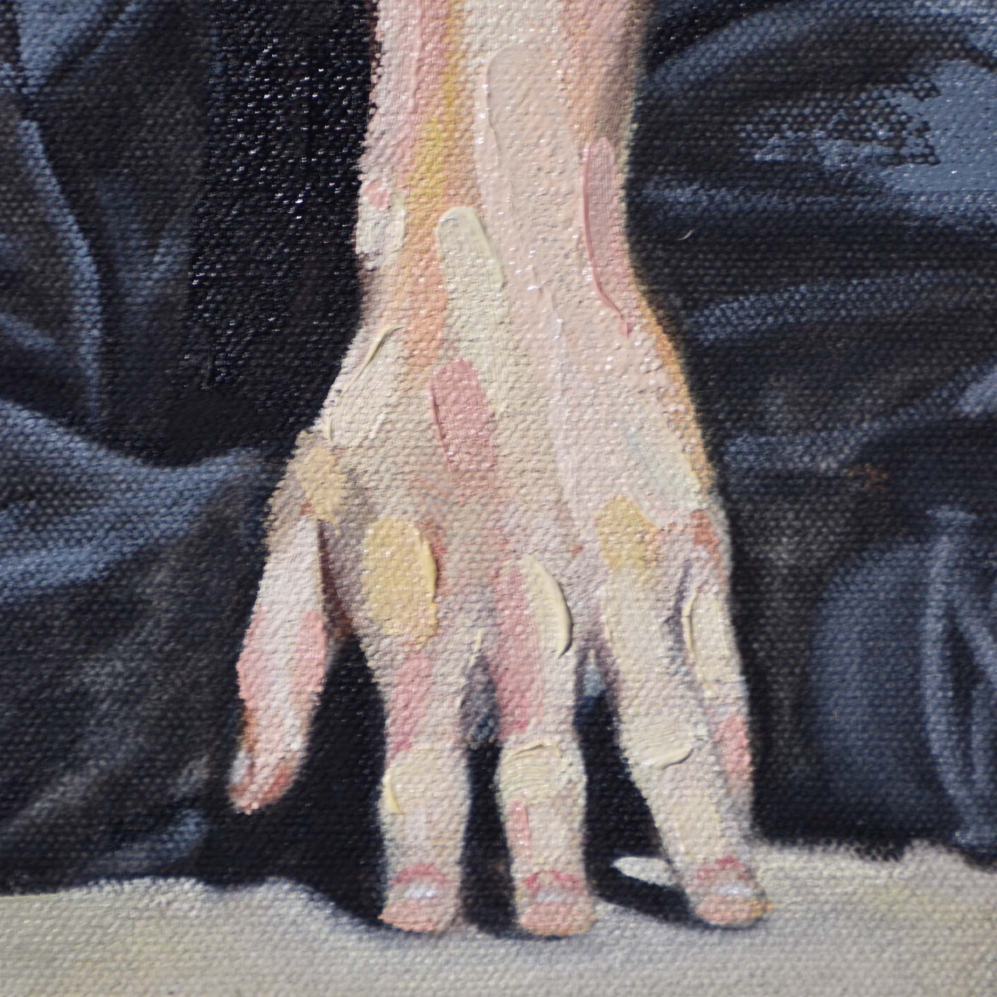 Close-up of a man's hand with patches of a textured fabric in the background of a Contemporary portrait painting.