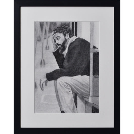 Framed portrait drawing titled 'Lost In My Head', 2025 depicting a man sitting on a metro seat.