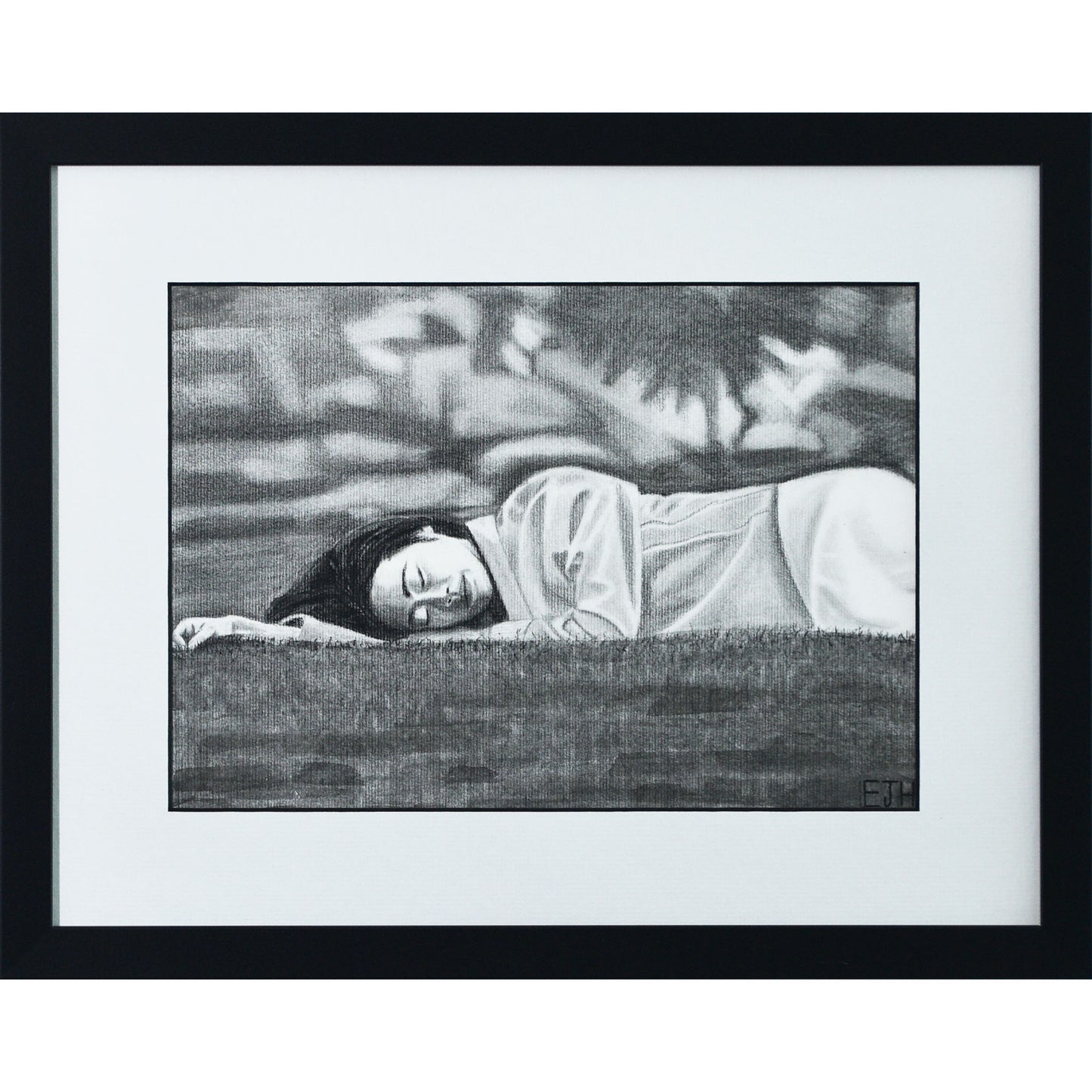 Framed portrait drawing titled 'Passing Of Time', 2025 depicting a female subject lying on grass with an abstract blurry background.