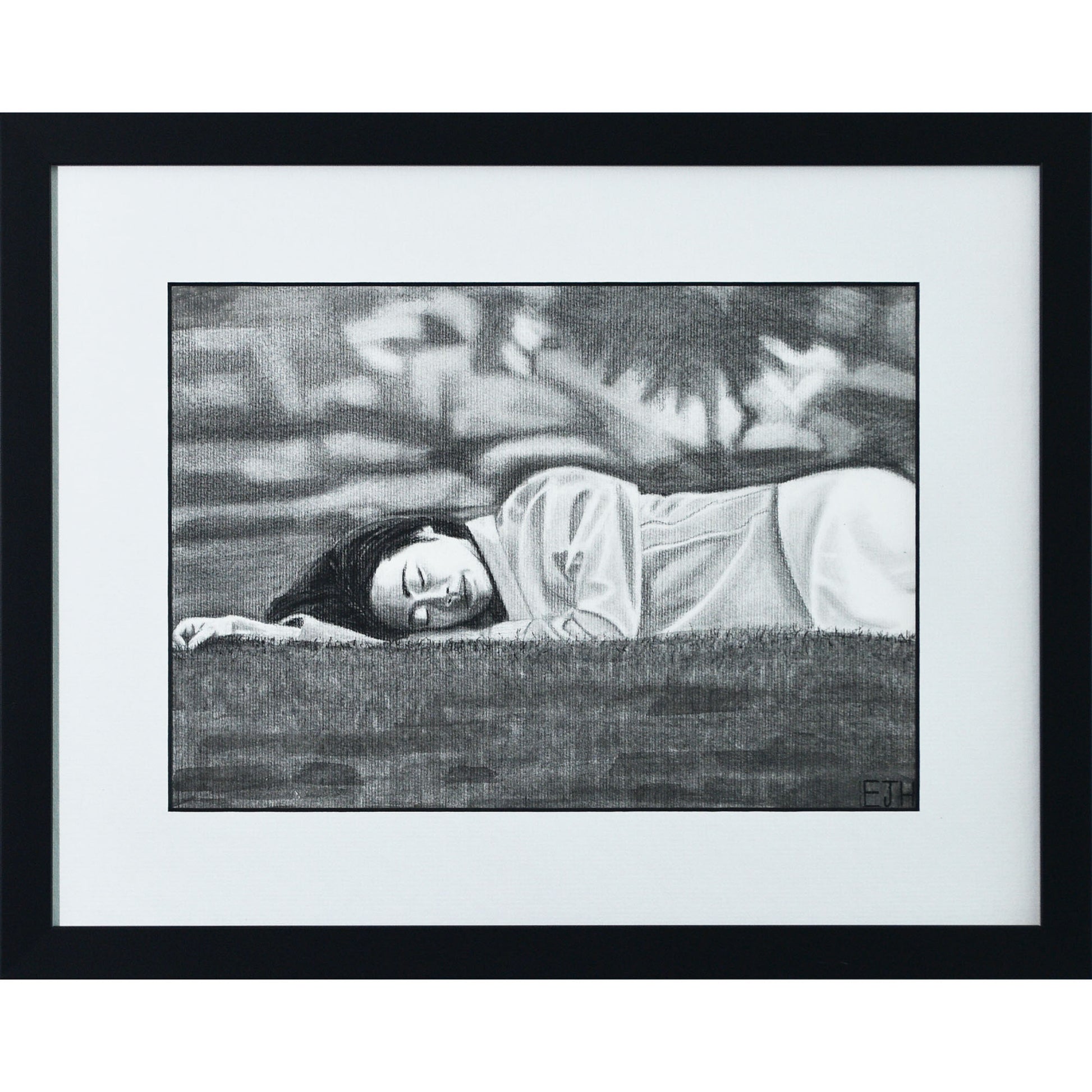 Framed portrait drawing titled 'Passing Of Time', 2025 depicting a female subject lying on grass with an abstract blurry background.