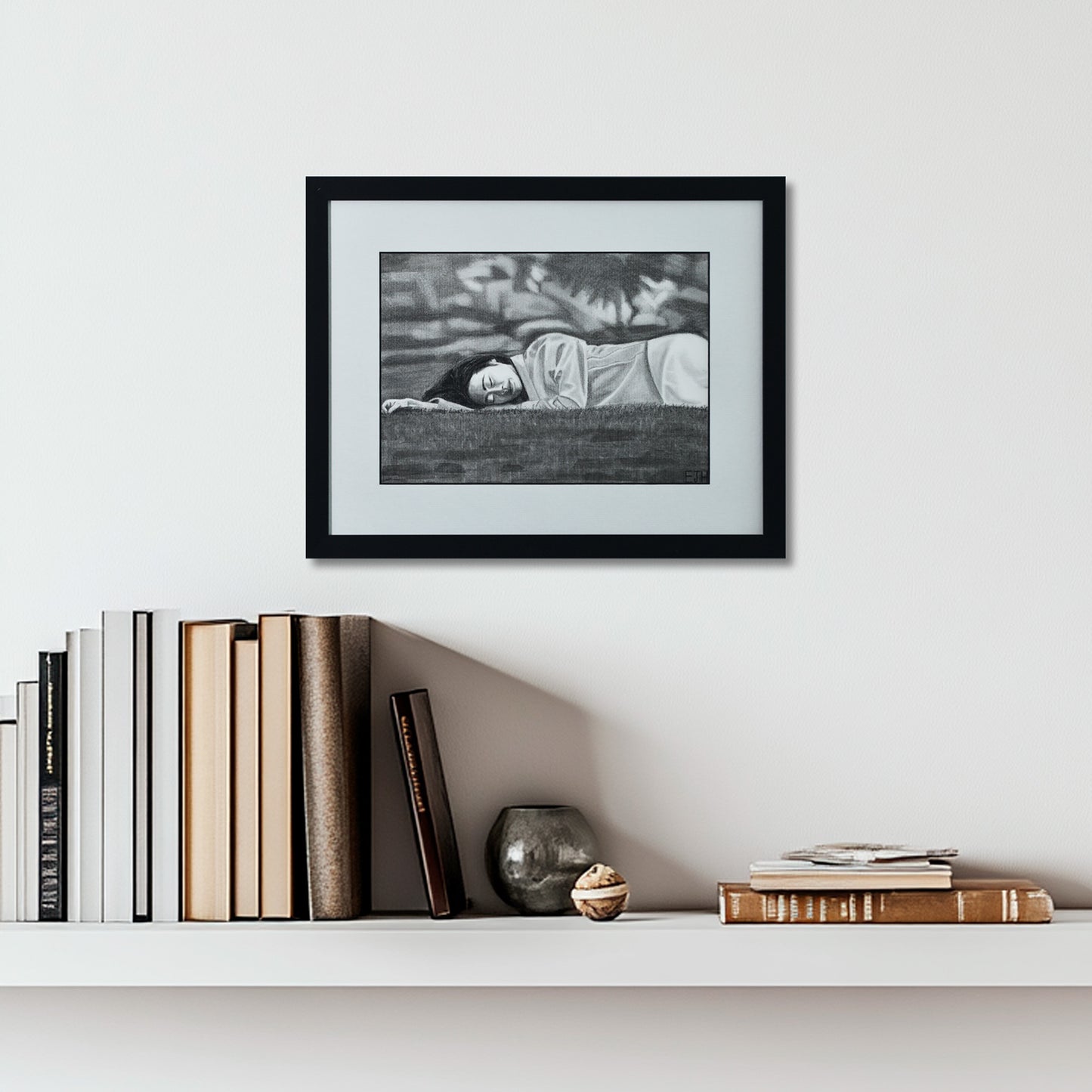 'Passing Of Time' framed portrait drawing hanging on a wall above a shelf with books and decorative items.