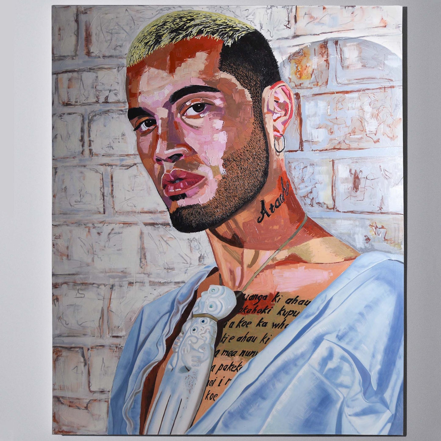 'Stan Walker' mixed media painting hanging on a neutral wall in the artist's studio.