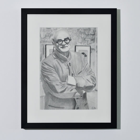 'The Art Dealer' framed portrait drawing of a man in jacket hanging on a neutral wall in the artist's studio.