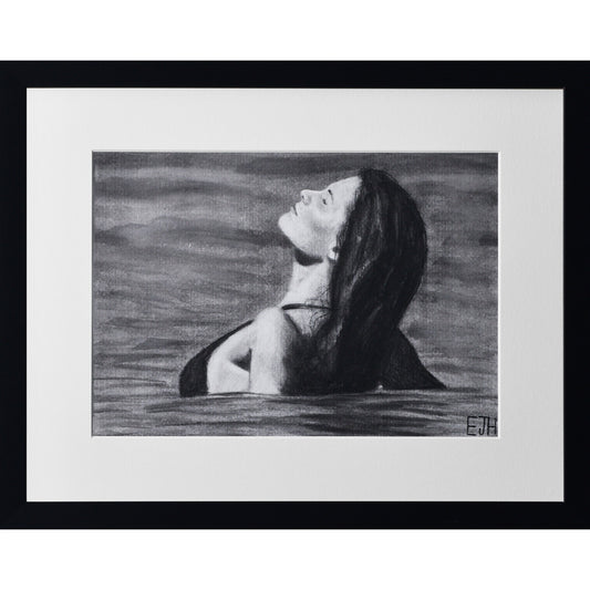 Framed portrait drawing titled 'The Sunbather', 2025 depicting a female subject in the ocean.