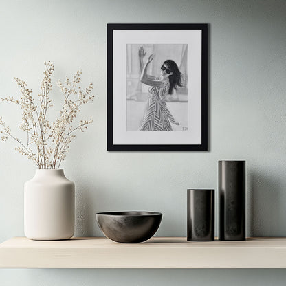 'When The World Prevails We Transform' framed portrait drawing hanging on a wall above a shelf with decorative items.